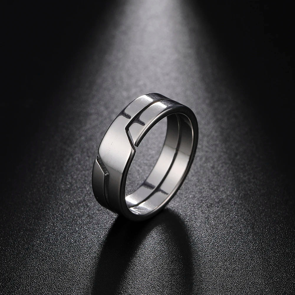 Close-up of Skyrim couple rings, stainless steel material with polished finish, showing geometric details.