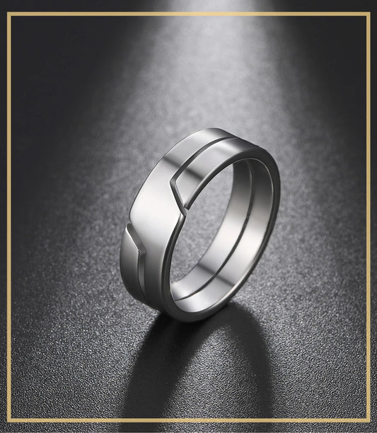 Skyrim stainless steel couple rings displayed side by side on a white background, simple fashion design for men and women.